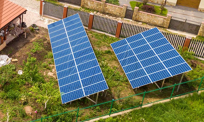  Professional solar installer mounting PV modules on a residential shingle roof using aluminum racking system